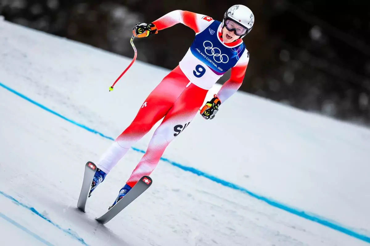 Switzerland's Marco Odermatt speeds down the course during the alpine ski, men's downhill first official training, at the 2026 Winter Olympics, in Bormio, Italy, Wednesday, Feb. 4, 2026. (Michael Buholzer/Keystone via AP)