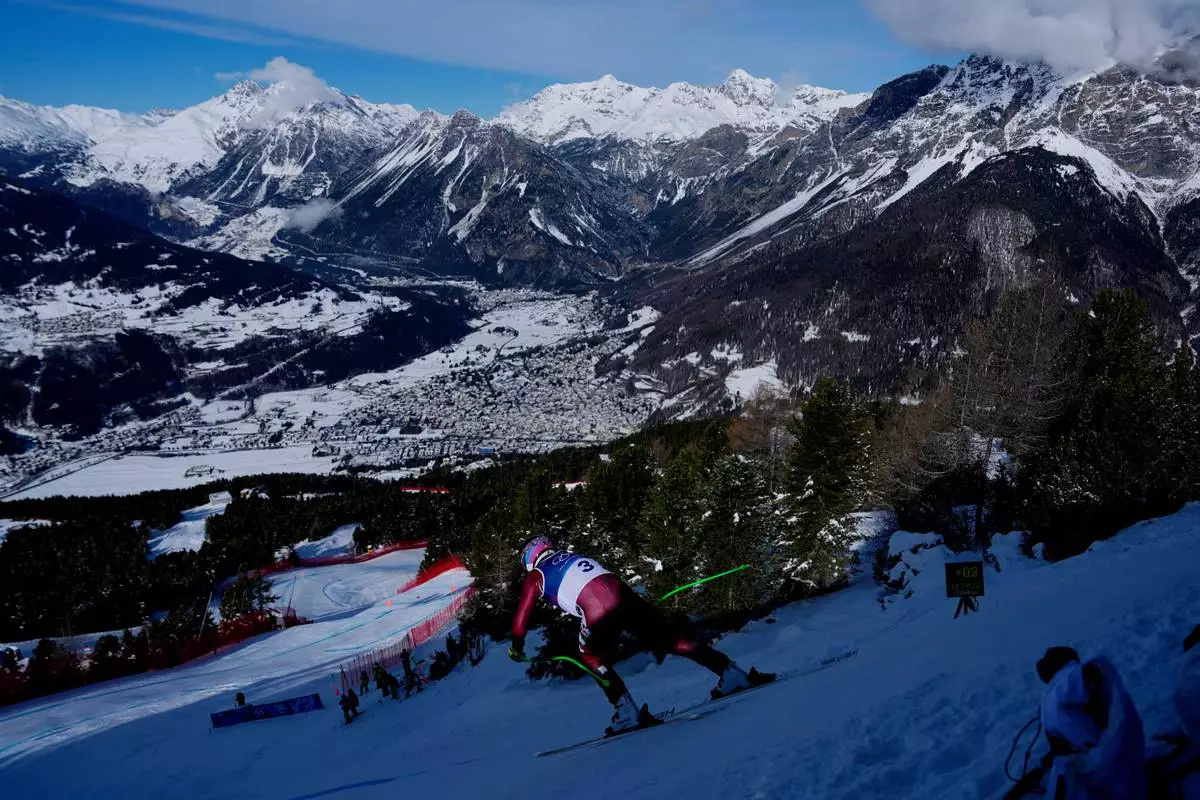 Canada's James Crawford starts an alpine ski, men's downhill official training, at the 2026 Winter Olympics, in Bormio, Italy, Thursday, Feb. 5, 2026. (AP Photo/Julia Demaree Nikhinson)