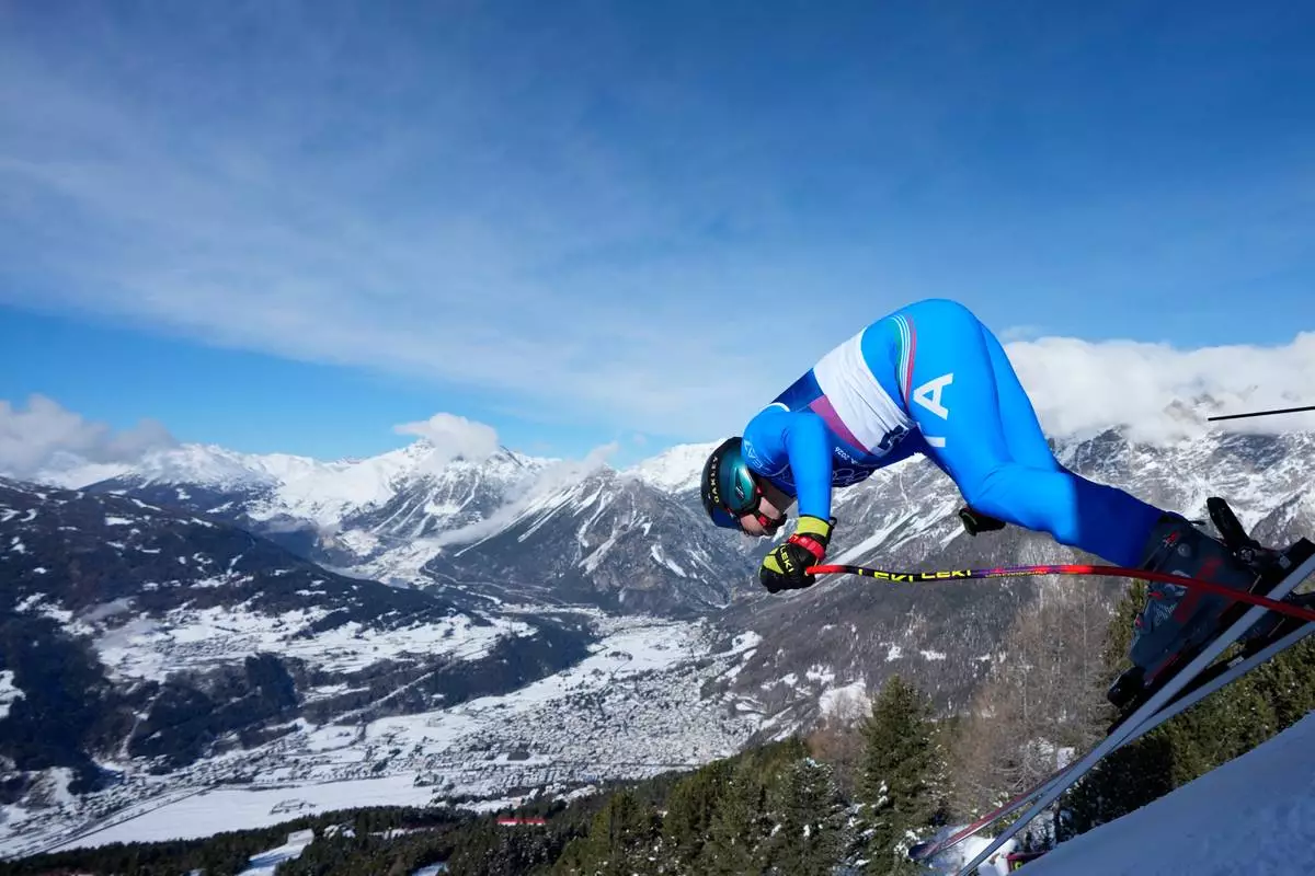 Italy's Giovanni Franzoni starts an alpine ski, men's downhill official training, at the 2026 Winter Olympics, in Bormio, Italy, Thursday, Feb. 5, 2026. (AP Photo/Julia Demaree Nikhinson)