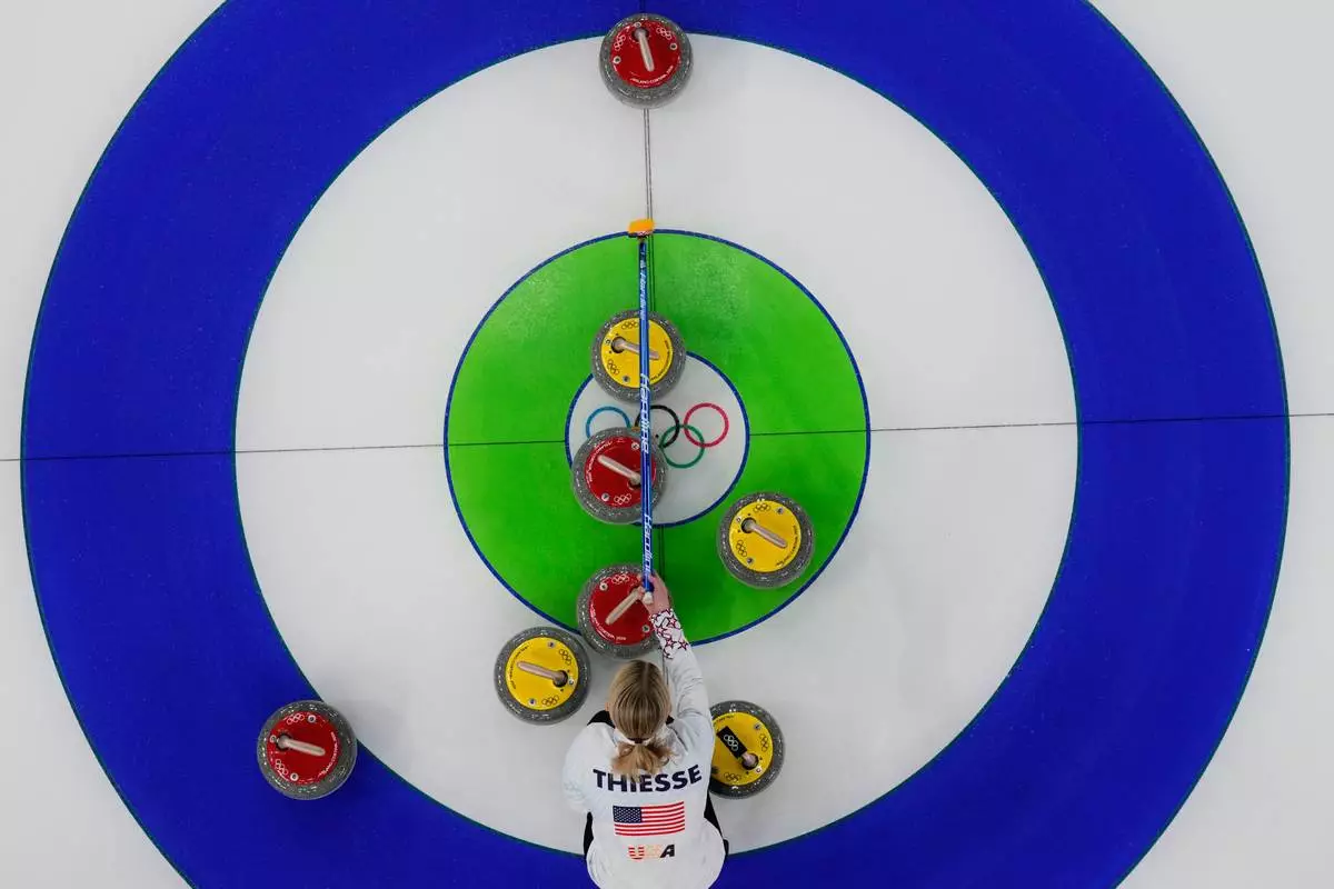 United States' Cory Thiesse competes against Norway during the mixed doubles round robin session 2 of the curling competition at the 2026 Winter Olympics, in Cortina d'Ampezzo, Italy, Thursday, Feb. 5, 2026. (AP Photo/Christophe Ena)