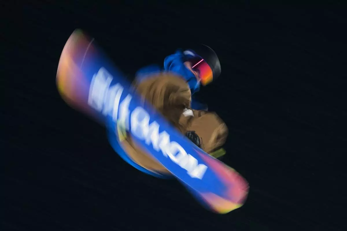 Germany's Noah Vicktor practices during a snowboard big air training session at the 2026 Winter Olympics, in Livigno, Italy, Wednesday, Feb. 4, 2026. (AP Photo/Gregory Bull)