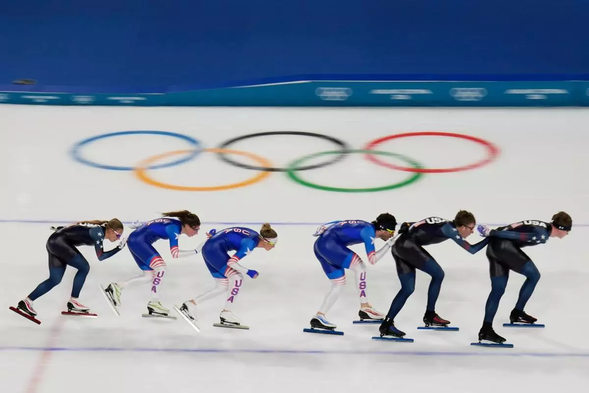 United States' women's and men's team pursuit speed skaters warm up, at the 2026 Winter Olympics, in Milan, Italy, Thursday, Feb. 5, 2026. (AP Photo/Luca Bruno)