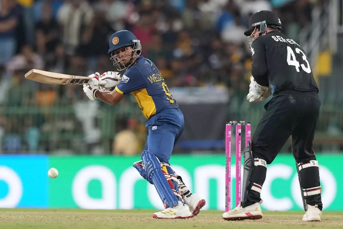 Sri Lanka's Dunith Wellalage plays a shot during the T20 World Cup cricket match between Sri Lanka and New Zealand in Colombo, Sri Lanka, Wednesday, Feb. 25, 2026. (AP Photo/Eranga Jayawardena)