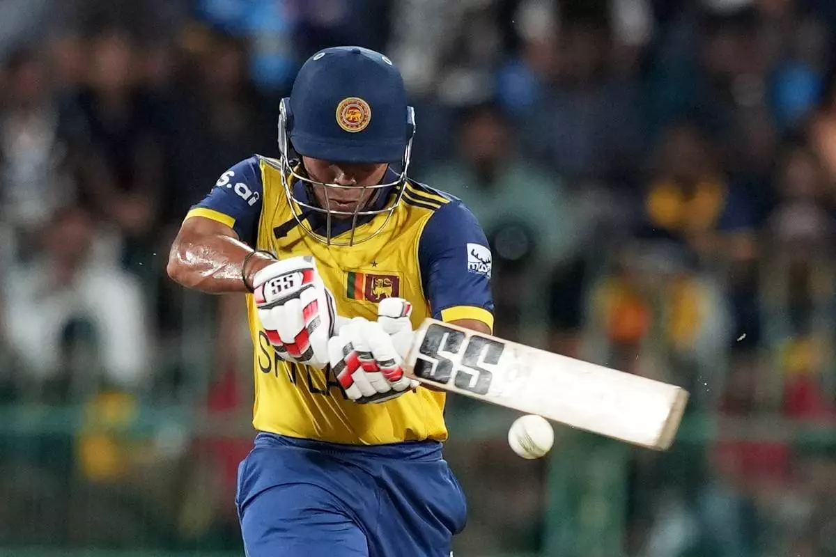 Sri Lanka's Dunith Wellalage plays a shot during the T20 World Cup cricket match between Sri Lanka and New Zealand in Colombo, Sri Lanka, Wednesday, Feb. 25, 2026. (AP Photo/Eranga Jayawardena)