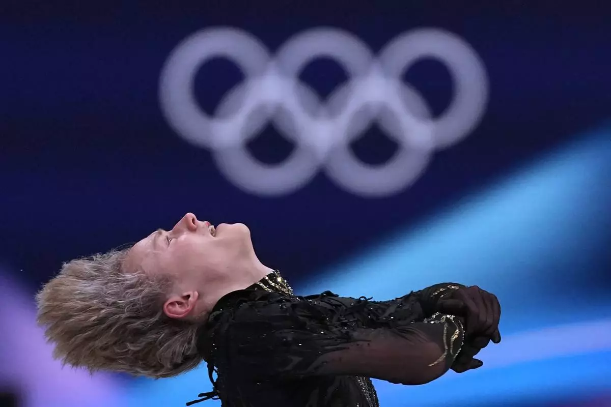 Ilia Malinin of the United States competes during the figure skating men's team event at the 2026 Winter Olympics, in Milan, Italy, Sunday, Feb. 8, 2026. (AP Photo/Stephanie Scarbrough)