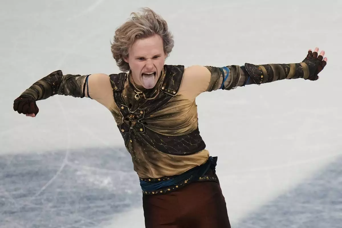 Ilia Malinin of the United States competes during the men's figure skating short program at the 2026 Winter Olympics, in Milan, Italy, Tuesday, Feb. 10, 2026. (AP Photo/Stephanie Scarbrough)