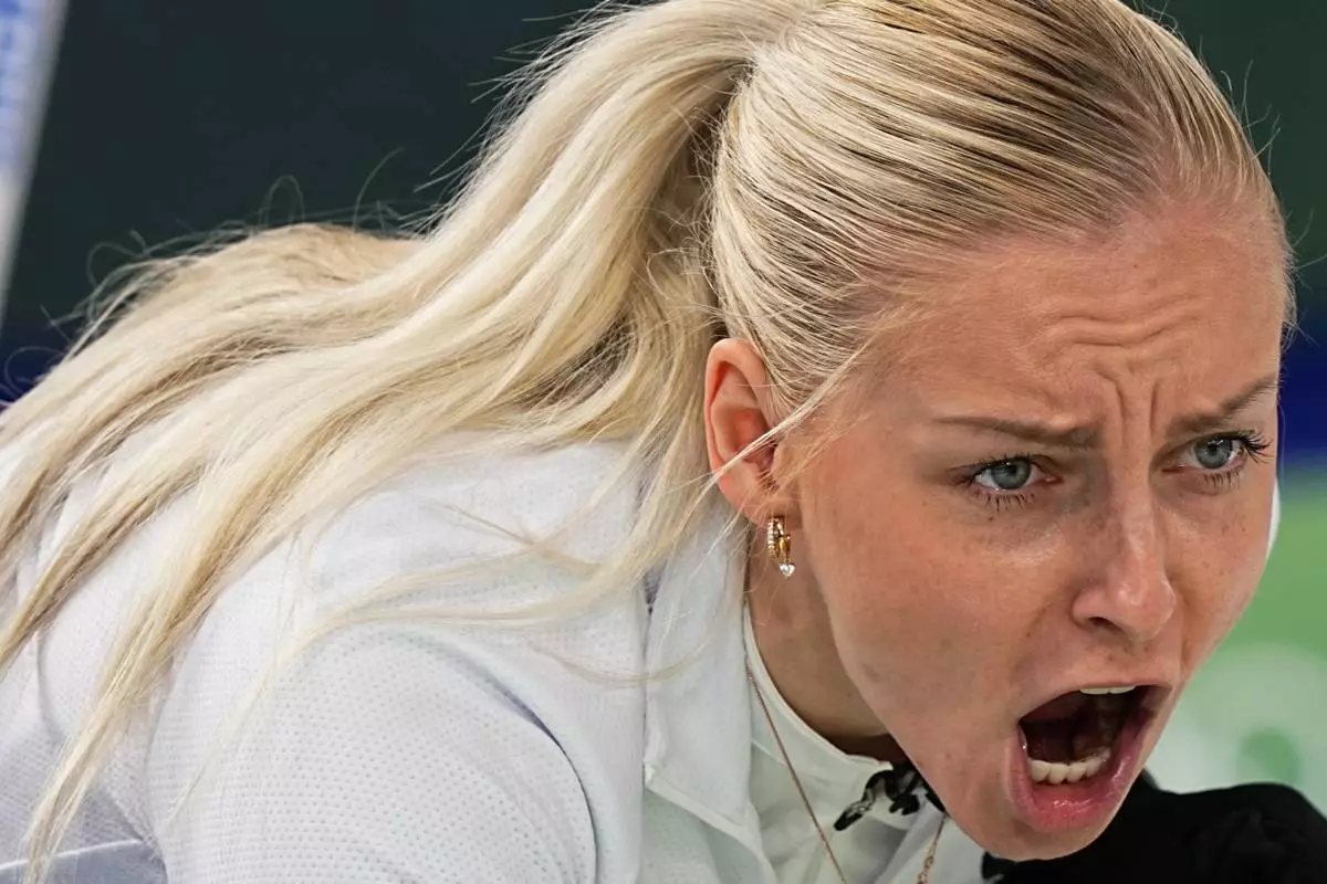 Estonia's Marie Kaldvee yells during the mixed doubles round robin phase of the curling competition against Britain, at the 2026 Winter Olympics, in Cortina d'Ampezzo, Italy, Thursday, Feb. 5, 2026. (AP Photo/Fatima Shbair)