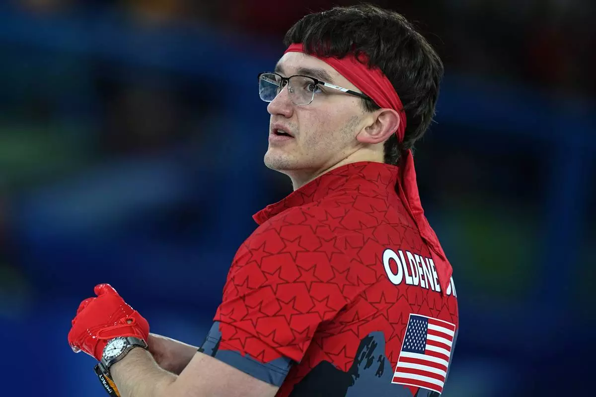United States' Aidan Oldenburg in action during the men's curling round robin session against Switzerland, at the 2026 Winter Olympics, in Cortina d'Ampezzo, Italy, Thursday, Feb. 12, 2026. (AP Photo/Fatima Shbair)