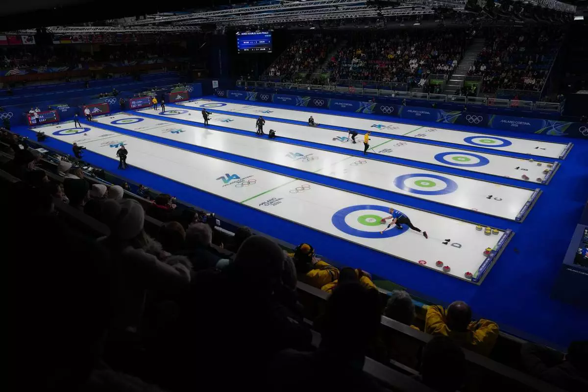 A view of the action during the semi-finals round of the mixed doubles curling match, at the 2026 Winter Olympics, in Cortina d'Ampezzo, Italy, Monday, Feb. 9, 2026. (AP Photo/Misper Apawu)