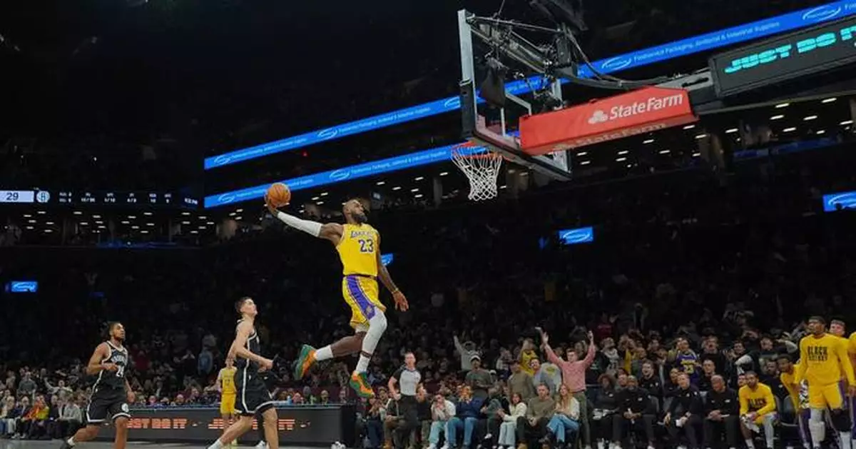 James and Doncic help Lakers rout Nets 125-109 in Austin Reaves' return from injury