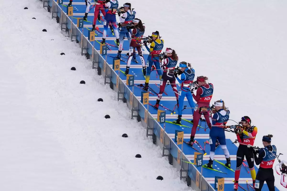 Athletes compete in the women's 4x6-kilometer relay biathlon race at the 2026 Winter Olympics in Anterselva, Italy, Wednesday, Feb. 18, 2026. (AP Photo/Mosa'ab Elshamy)