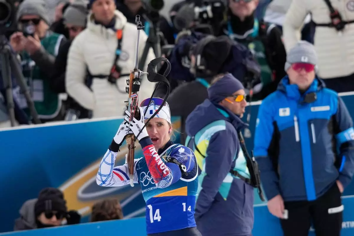 France's Julia Simon prepares to shoot during the women's biathlon 4 x 6-kilometers relay race at the 2026 Winter Olympics, in Anterselva, Italy, Wednesday, Feb. 18, 2026. (AP Photo/David J. Phillip)