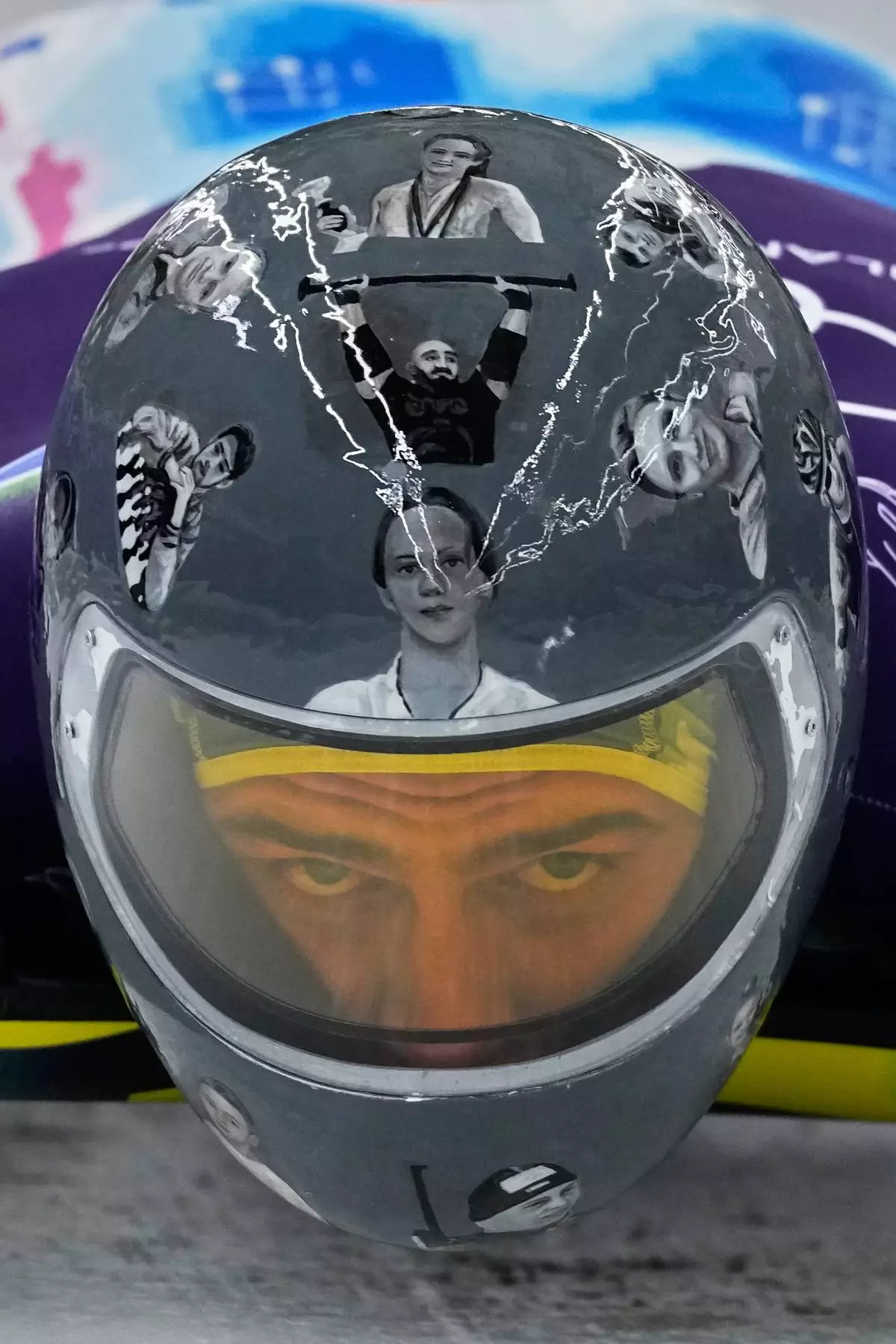 Ukraine's Vladyslav Heraskevych starts for a men's skeleton training session at the 2026 Winter Olympics, in Cortina d'Ampezzo, Italy, Wednesday, Feb. 11, 2026. (AP Photo/Aijaz Rahi)