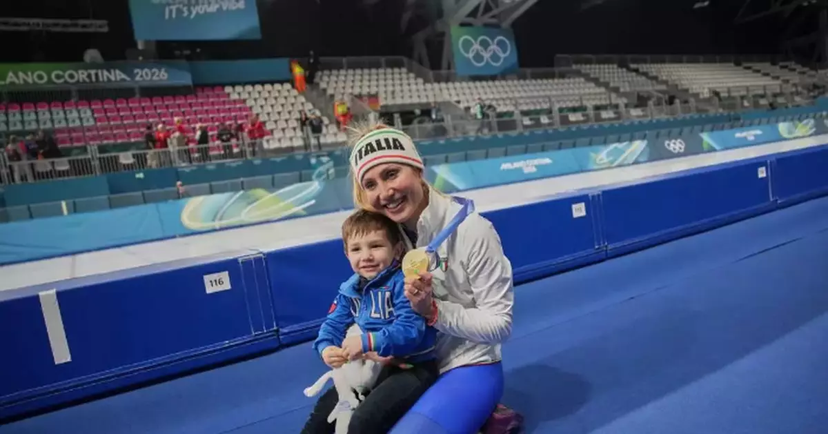 Francesca Lollobrigida hugs her son after winning Italy's first gold of the Milan Olympics