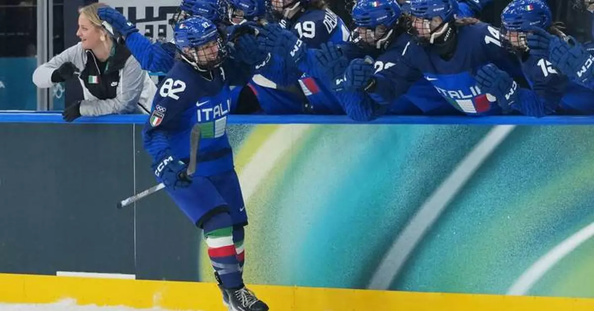 First game at the new Olympic hockey arena turns into a celebration for host Italy