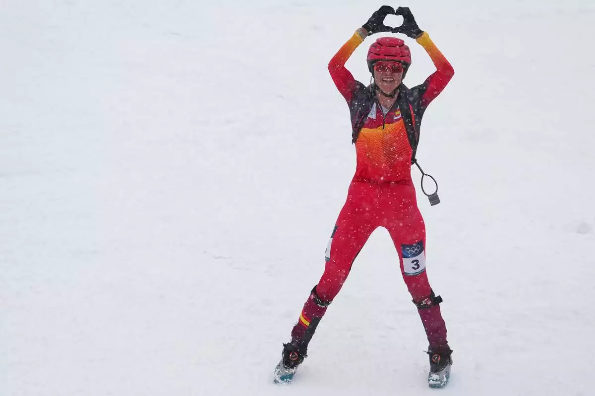 Spain's Ana Alonso Rodriguez celebrates taking third place in a ski mountaineering women's sprint final, at the 2026 Winter Olympics, in Bormio, Italy, Thursday, Feb. 19, 2026. (AP Photo/Rebecca Blackwell)