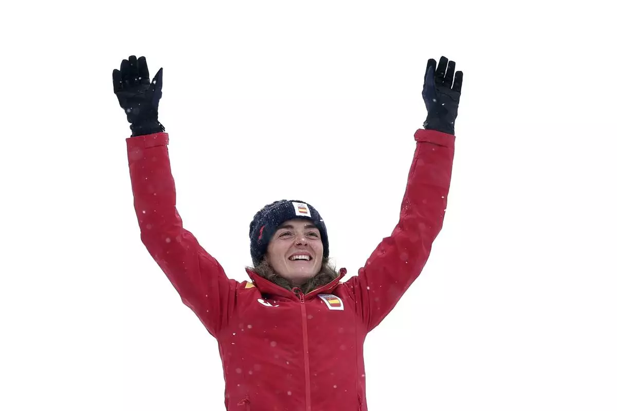 Spain's Ana Alonso Rodriguez celebrates after winning the bronze medal in a ski mountaineering women's sprint final, at the 2026 Winter Olympics, in Bormio, Italy, Thursday, Feb. 19, 2026. (AP Photo/Gabriele Facciotti)
