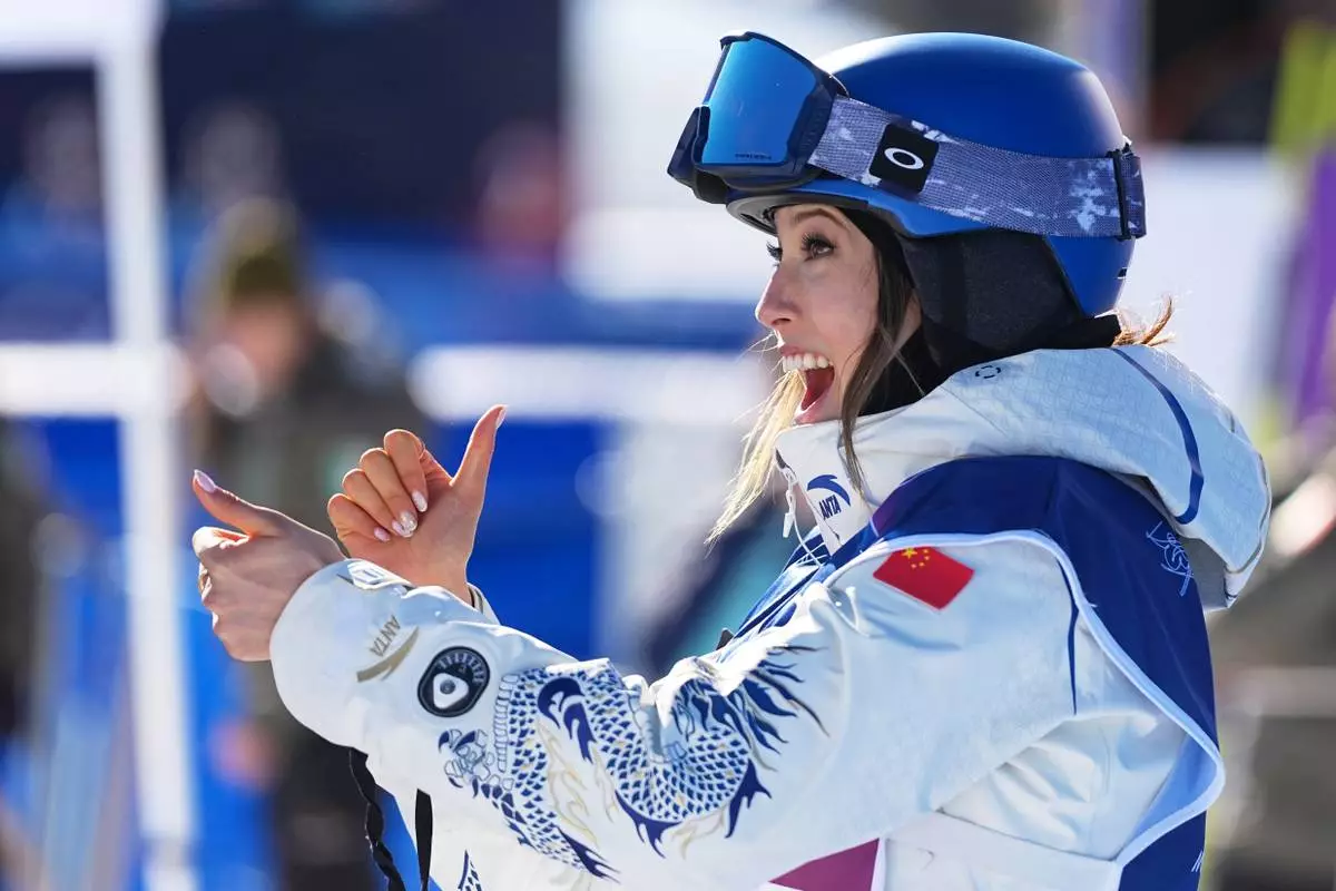 China's Eileen Gu celebrates competes during women's freestyle skiing slopestyle qualifications at the 2026 Winter Olympics, in Livigno, Italy, Saturday, Feb. 7, 2026. (AP Photo/Gregory Bull)