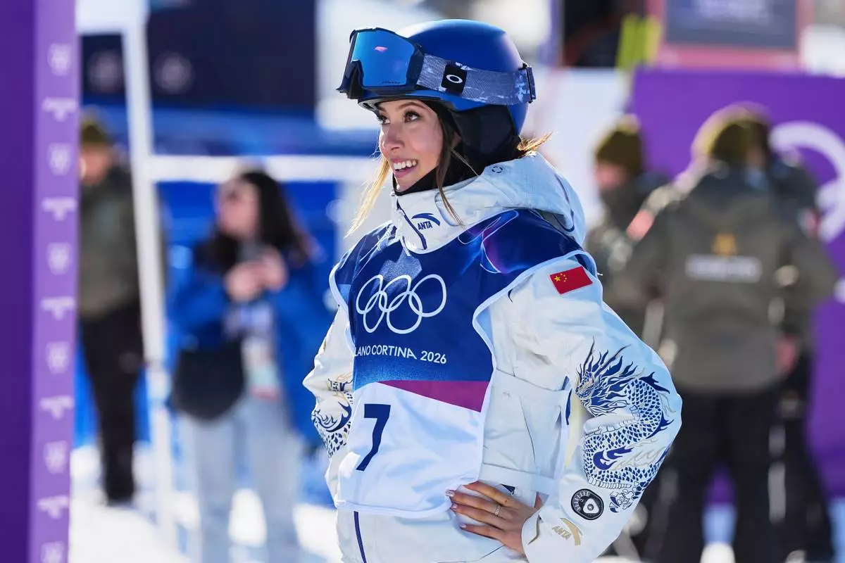 China's Eileen Gu looks on during women's freestyle skiing slopestyle qualifications at the 2026 Winter Olympics, in Livigno, Italy, Saturday, Feb. 7, 2026. (AP Photo/Gregory Bull)