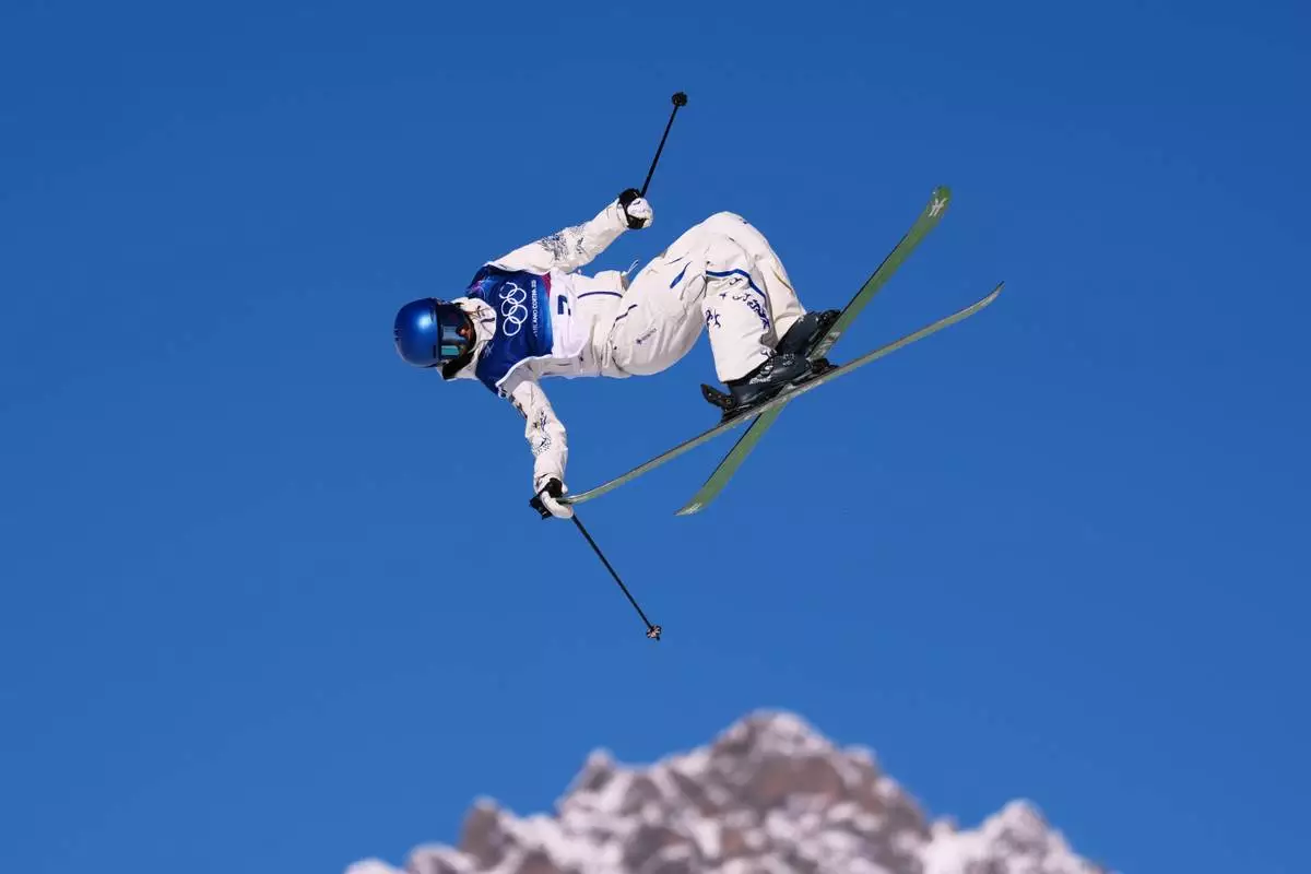 China's Eileen Gu competes during women's freestyle skiing slopestyle qualifications at the 2026 Winter Olympics, in Livigno, Italy, Saturday, Feb. 7, 2026. (AP Photo/Abbie Parr)