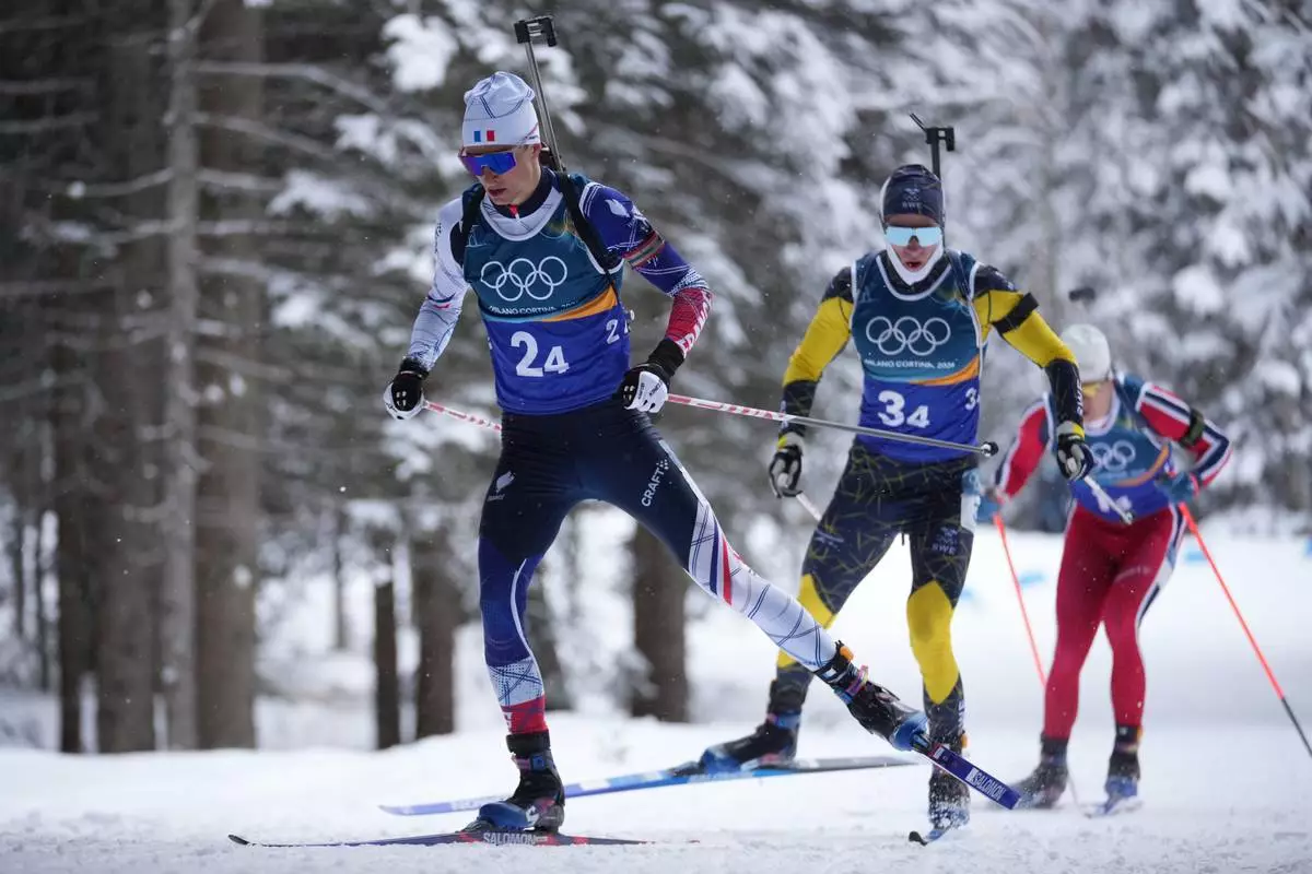 Eric Perrot, of France, competes in the men's 4x7.5-kilometer relay biathlon race at the 2026 Winter Olympics in Anterselva, Italy, Tuesday, Feb. 17, 2026. (AP Photo/Andrew Medichini)