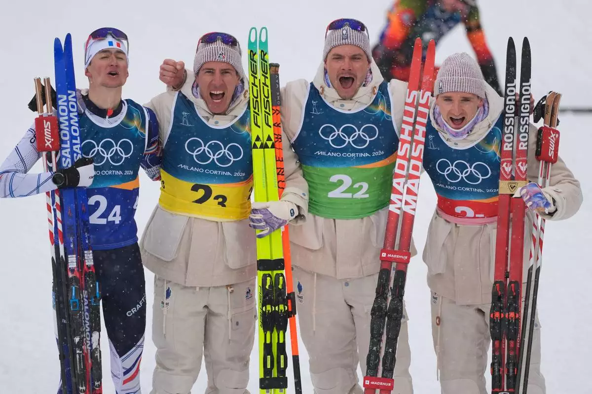 France's Eric Perrot, from left, Quentin Fillon Maillet, Emilien Jacquelin and Fabien Claude react after winning gold in the men's 4x7.5-kilometer relay biathlon race at the 2026 Winter Olympics in Anterselva, Italy, Tuesday, Feb. 17, 2026. (AP Photo/Andrew Medichini)