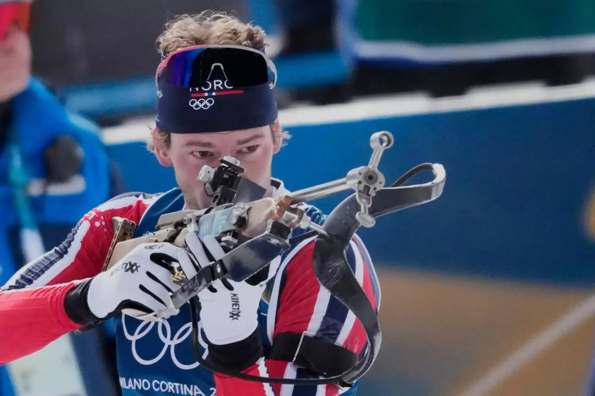 Sturla Holm Laegreid of Norway competes during the biathlon Men's 12.5km pursuit at the 2026 Winter Olympics, in Anterselva, Italy, Sunday, Feb. 15, 2026. (AP Photo/Christophe Ena)