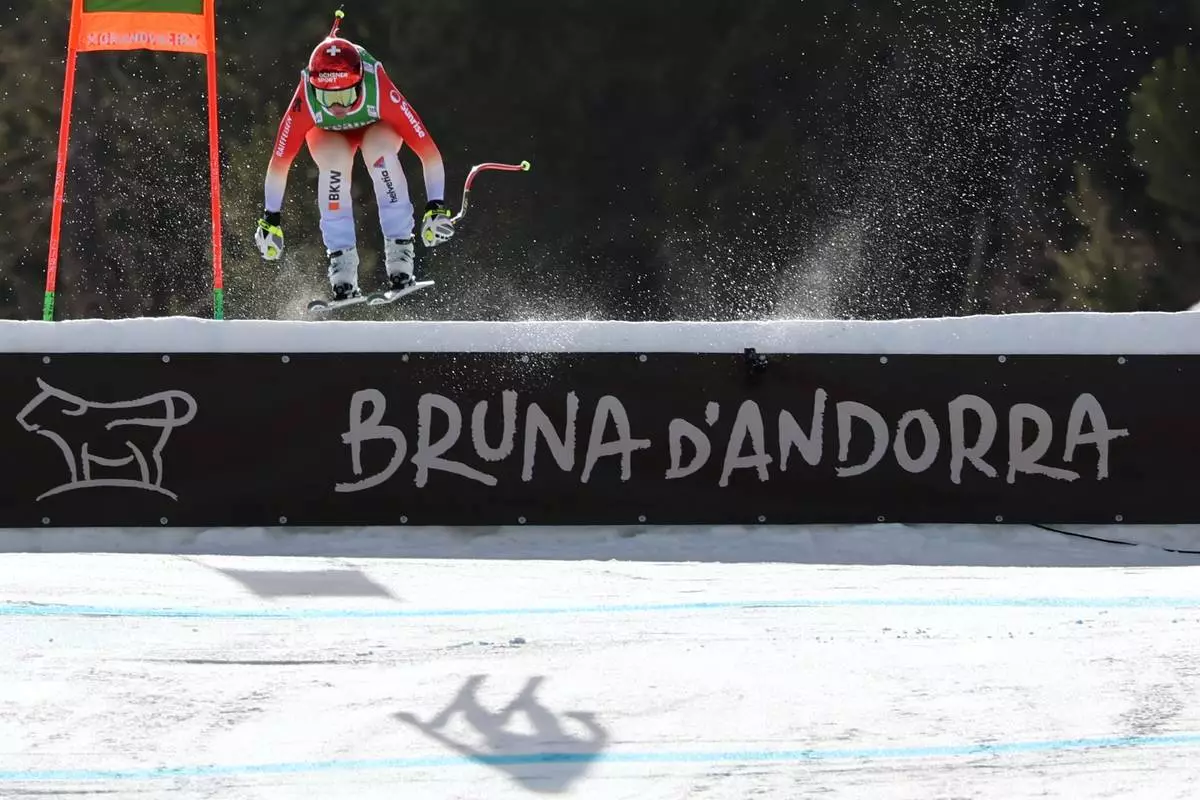 Switzerland's Corinne Suter arrives at the finish area of an alpine ski, women's World Cup downhill, in Soldeu, Andorra, Friday, February. 27, 2026. (AP Photo/Marco Trovati)