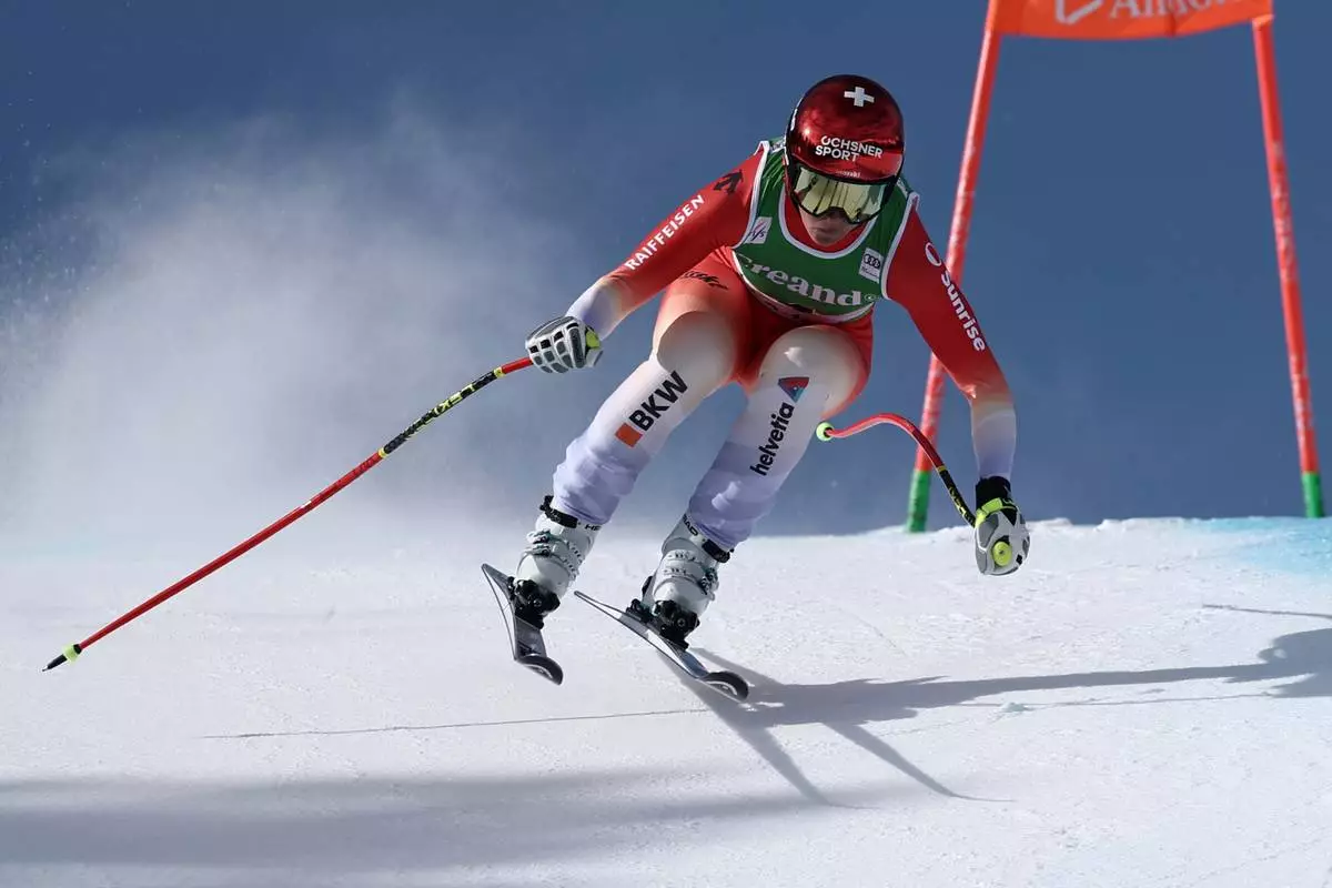 Switzerland's Corinne Suter speeds down the course during an alpine ski, women's World Cup downhill, in Soldeu, Andorra, Friday, February. 27, 2026. (AP Photo/Gabriele Facciotti)