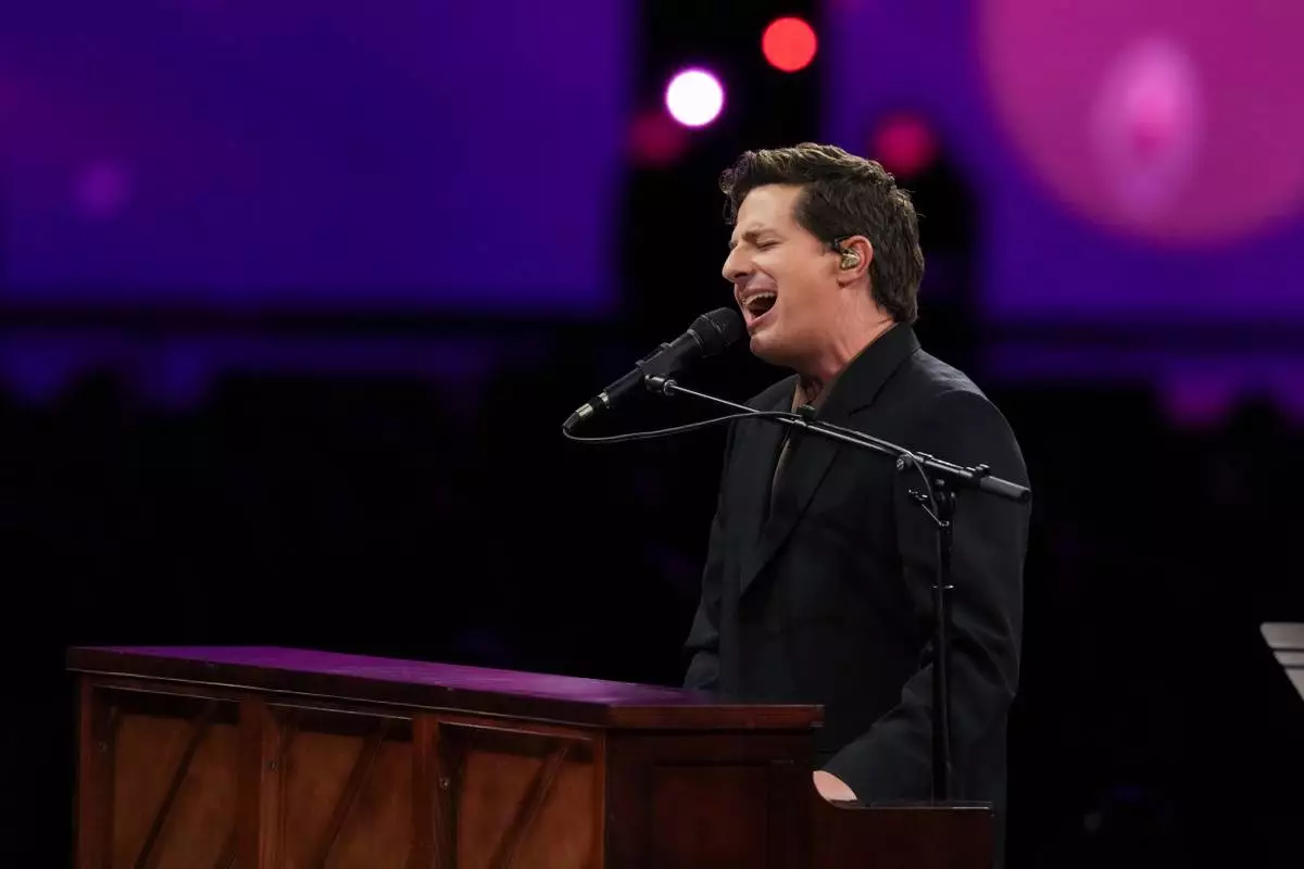 Charlie Puth performs 'I Still Believe' during MusiCares Person of the Year honoring Mariah Carey on Friday, Jan. 30, 2026, in Los Angeles. (AP Photo/Chris Pizzello)