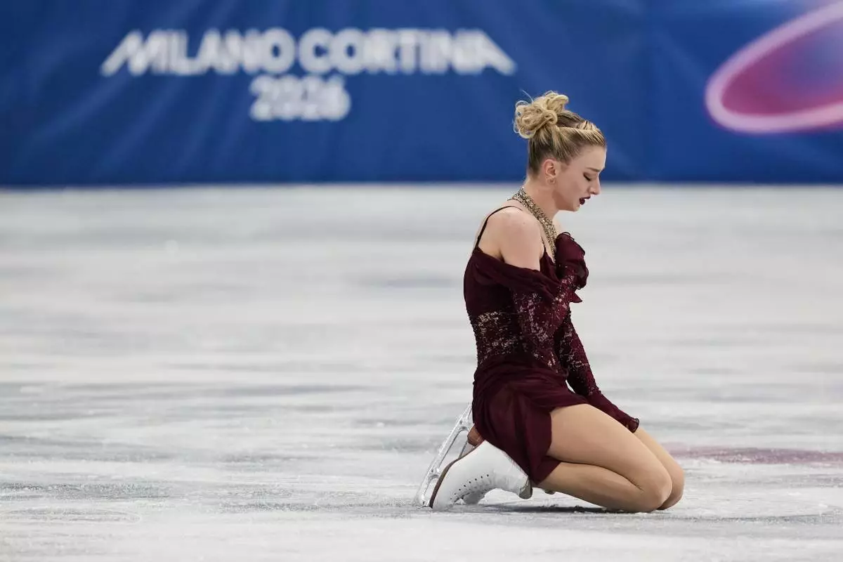 Amber Glenn of the United States competes during the women's short program figure skating at the 2026 Winter Olympics, in Milan, Italy, Tuesday, Feb. 17, 2026. (AP Photo/Francisco Seco)