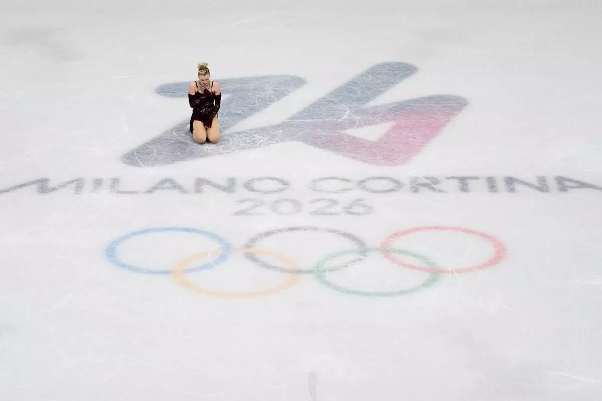 Amber Glenn of the United States competes during the women's short program figure skating at the 2026 Winter Olympics, in Milan, Italy, Tuesday, Feb. 17, 2026. (AP Photo/Ashley Landis)