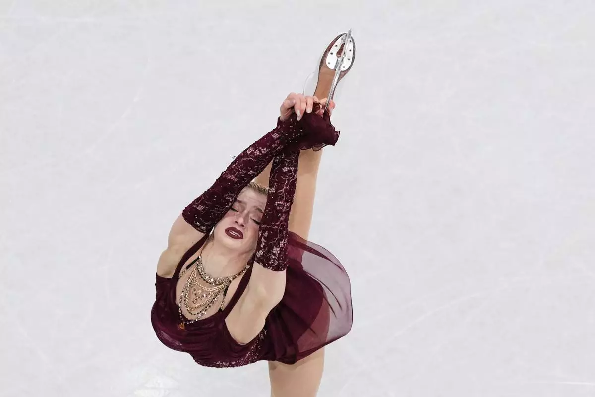 Amber Glenn of the United States competes during the women's short program figure skating at the 2026 Winter Olympics, in Milan, Italy, Tuesday, Feb. 17, 2026. (AP Photo/Bernat Armangue)