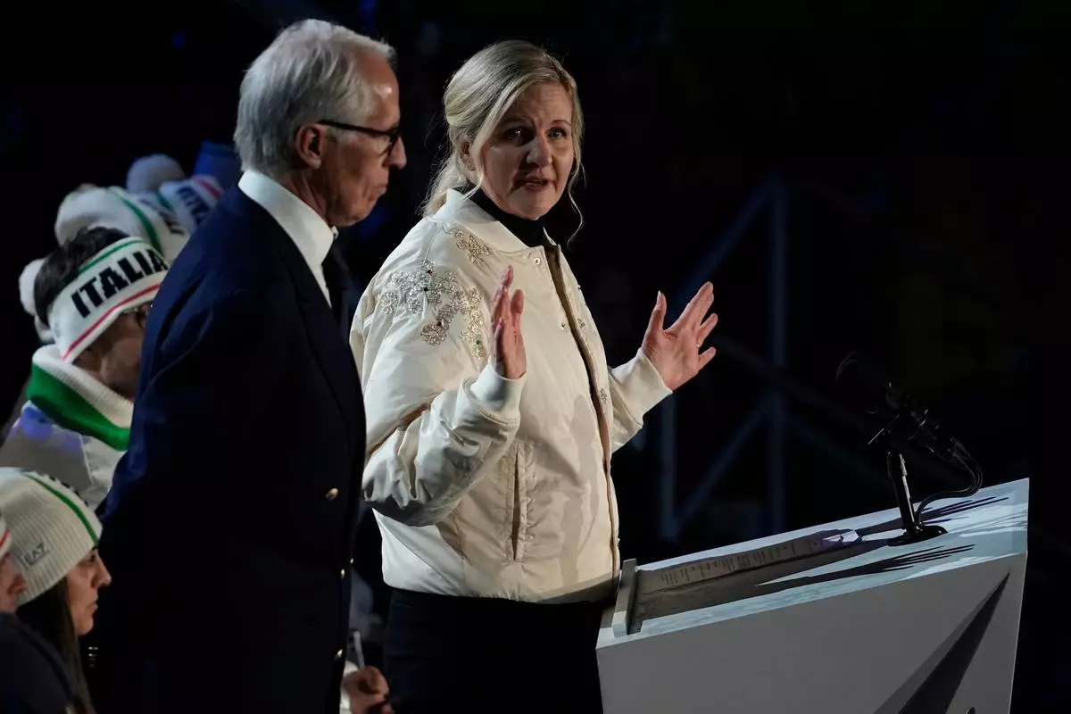 IOC President Kirsty Coventry, right, speaks next to President of the Milan Cortina 2026 foundation Giovanni Malago during the closing ceremony of the 2026 Winter Olympics, in Verona, Italy, Sunday, Feb. 22, 2026. (AP Photo/Ashley Landis)