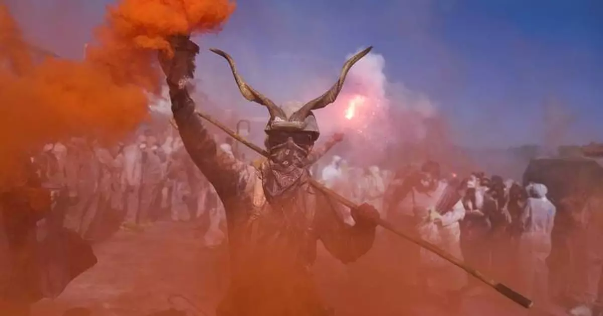 'Flour war' erupts in Greek seaside town as revelers celebrate the start of Lent