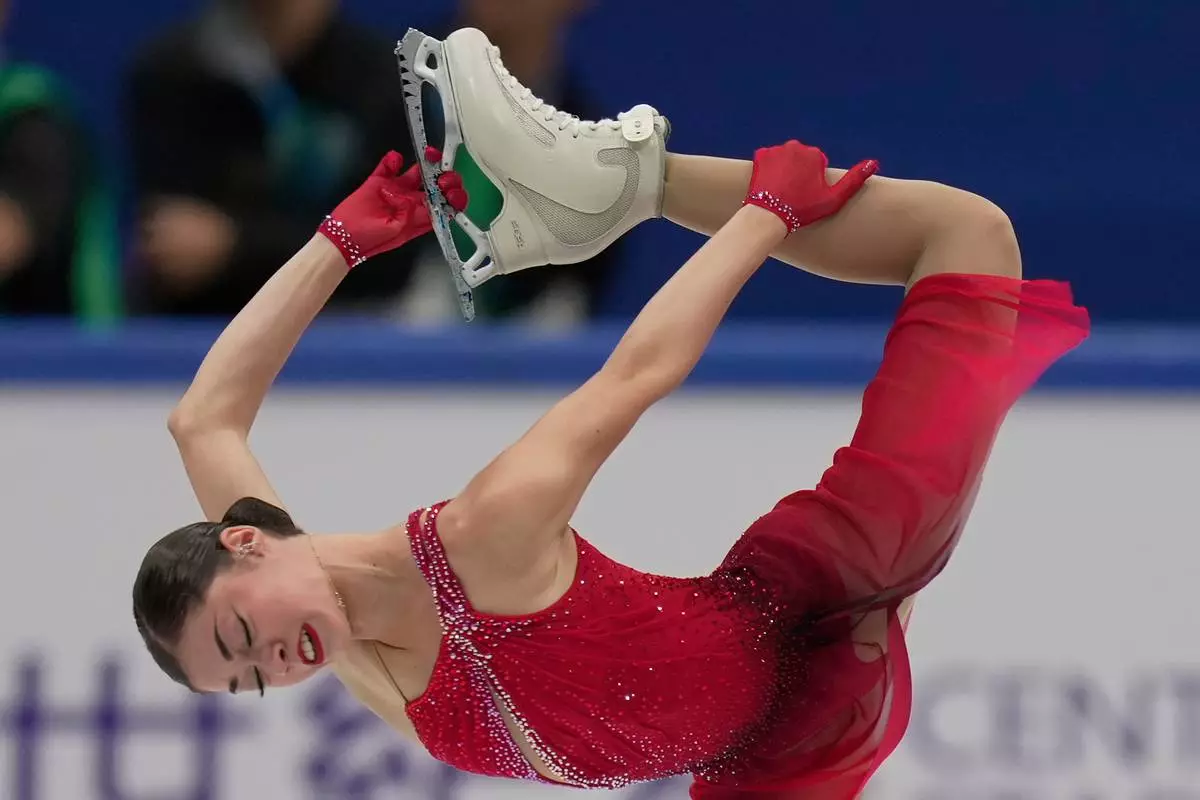 FILE - Adeliia Petrosian of Russia, competing as a neutral athlete, performs during the women's free skating program at the ISU Skate to Milano figure skating qualifier, Saturday, Sept. 20, 2025, in Beijing, China. (AP Photo/Mahesh Kumar A., File)