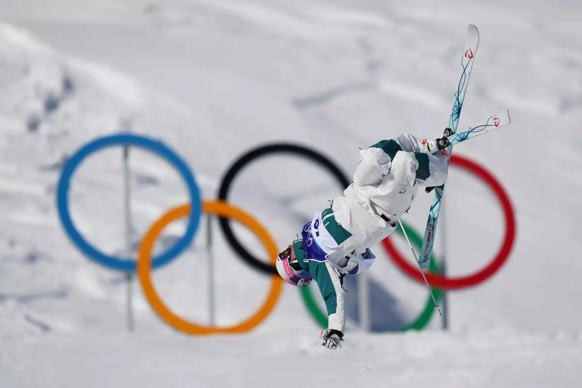 Australia's Cooper Woods competes during the men's freestyle skiing moguls qualifications at the 2026 Winter Olympics, in Livigno, Italy, Thursday, Feb. 12, 2026. (AP Photo/Abbie Parr)