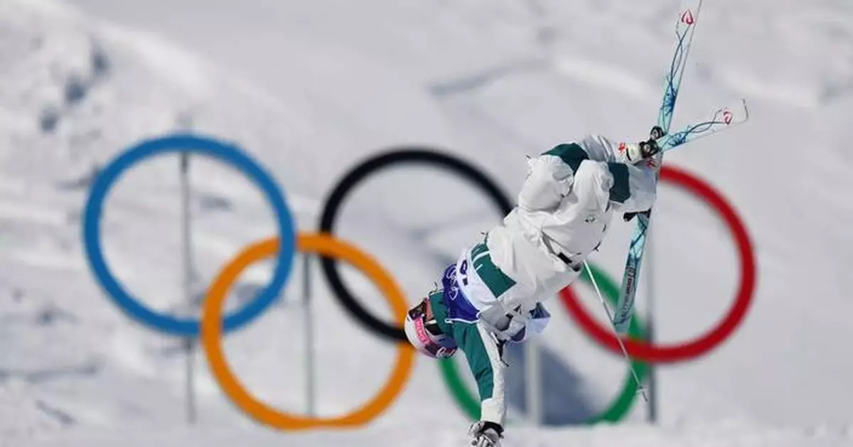 Cooper Woods upsets Mikael Kingsbury for Olympic gold in men's moguls in a tiebreaker