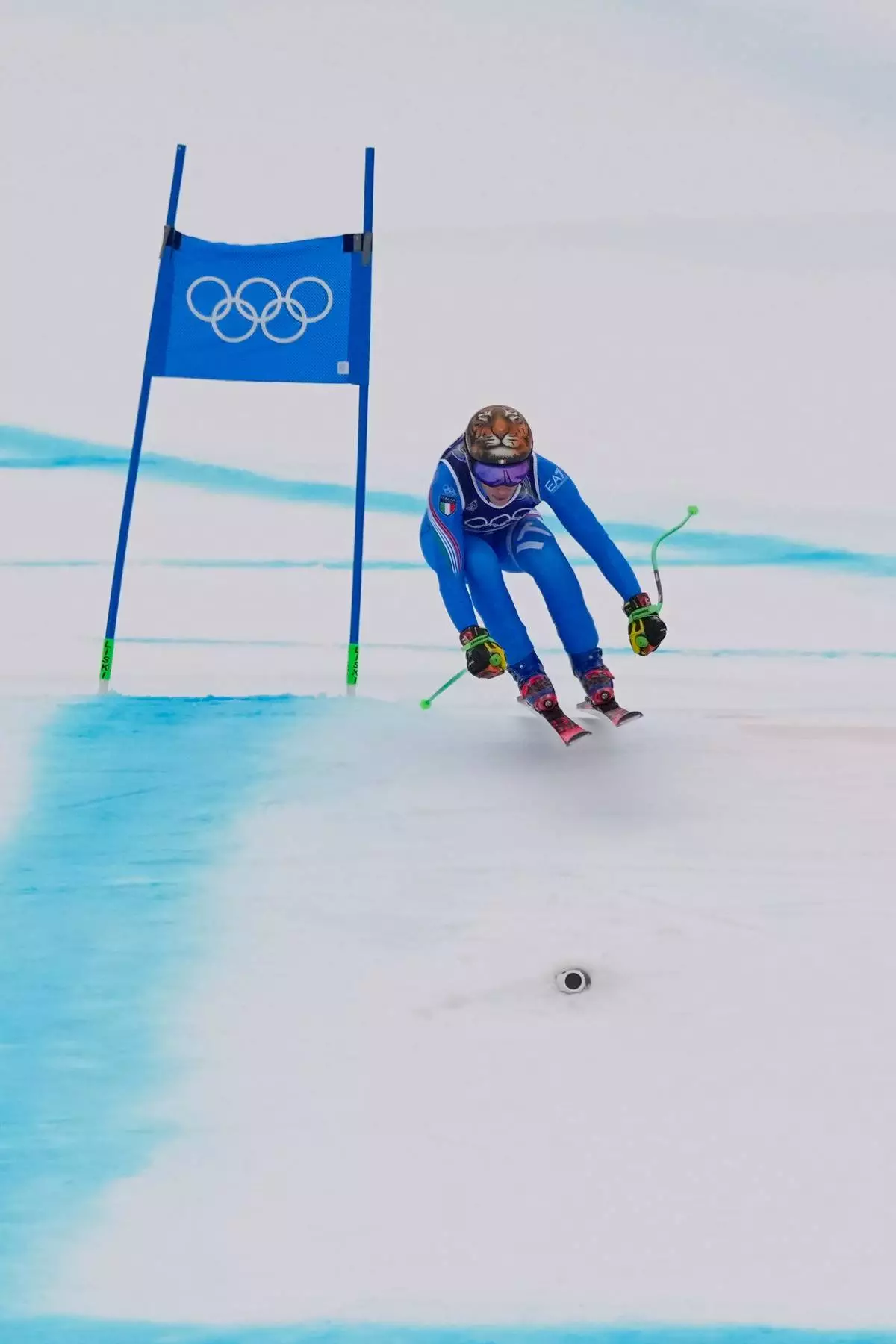 Italy's Federica Brignone speeds down the course during an alpine ski, women's super-G race, at the 2026 Winter Olympics, in Cortina d'Ampezzo, Italy, Thursday, Feb. 12, 2026. (AP Photo/Andy Wong)