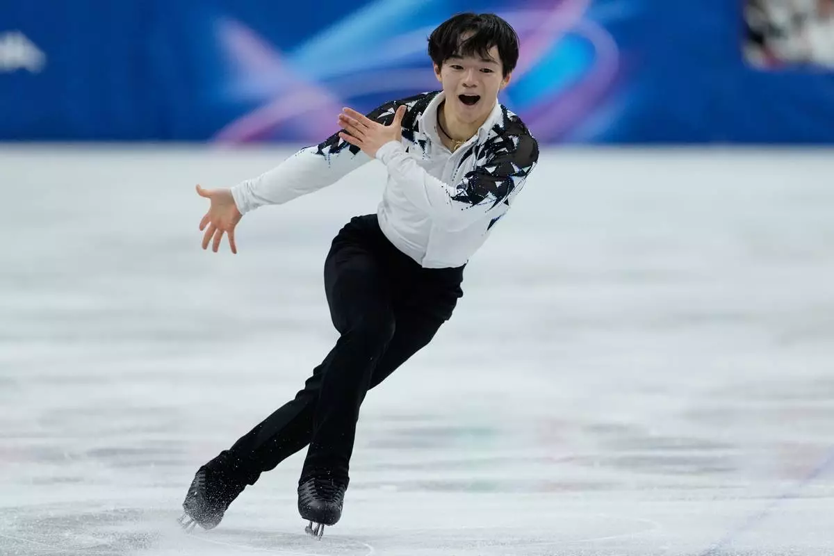 Yuma Kagiyama of Japan competes during the figure skating men's team event at the 2026 Winter Olympics, in Milan, Italy, Saturday, Feb. 7, 2026. (AP Photo/Natacha Pisarenko)