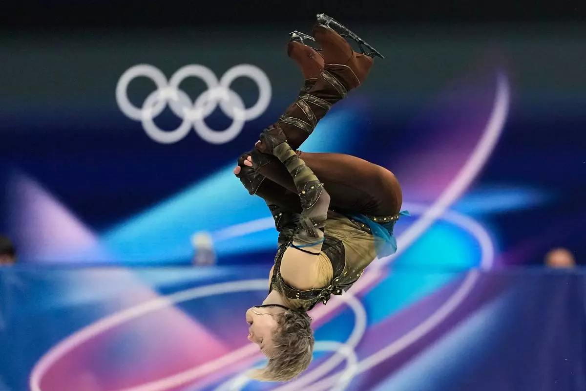 Ilia Malinin of the United States competes during the figure skating men's team event at the 2026 Winter Olympics, in Milan, Italy, Saturday, Feb. 7, 2026. (AP Photo/Natacha Pisarenko)