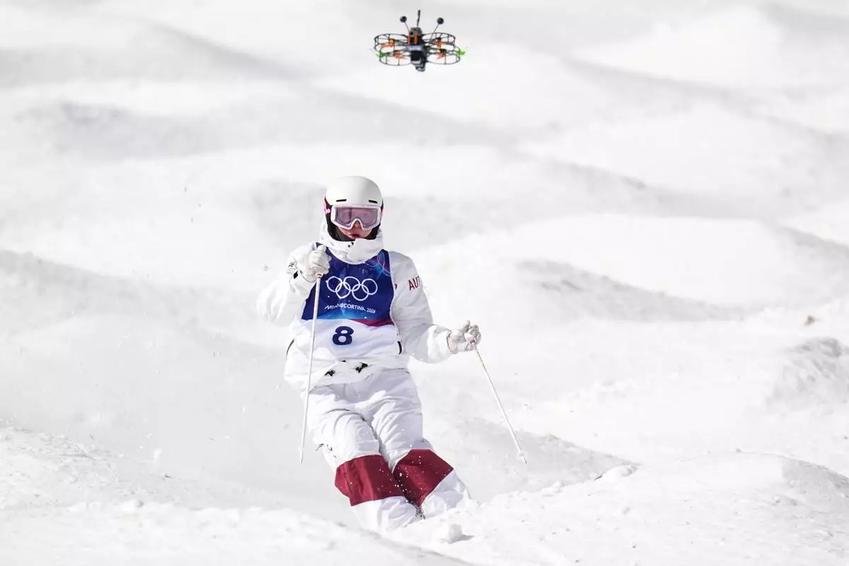 Austria's Avital Carroll competes during the women's freestyle skiing moguls qualifications at the 2026 Winter Olympics, in Livigno, Italy, Wednesday, Feb. 11, 2026. (AP Photo/Gregory Bull)