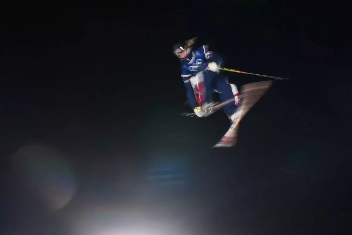 France's Kim Dumont Zanella competes in the women's freestyle skiing big air qualifications at the 2026 Winter Olympics, in Livigno, Italy, Saturday, Feb. 14, 2026. (AP Photo/Lindsey Wasson)