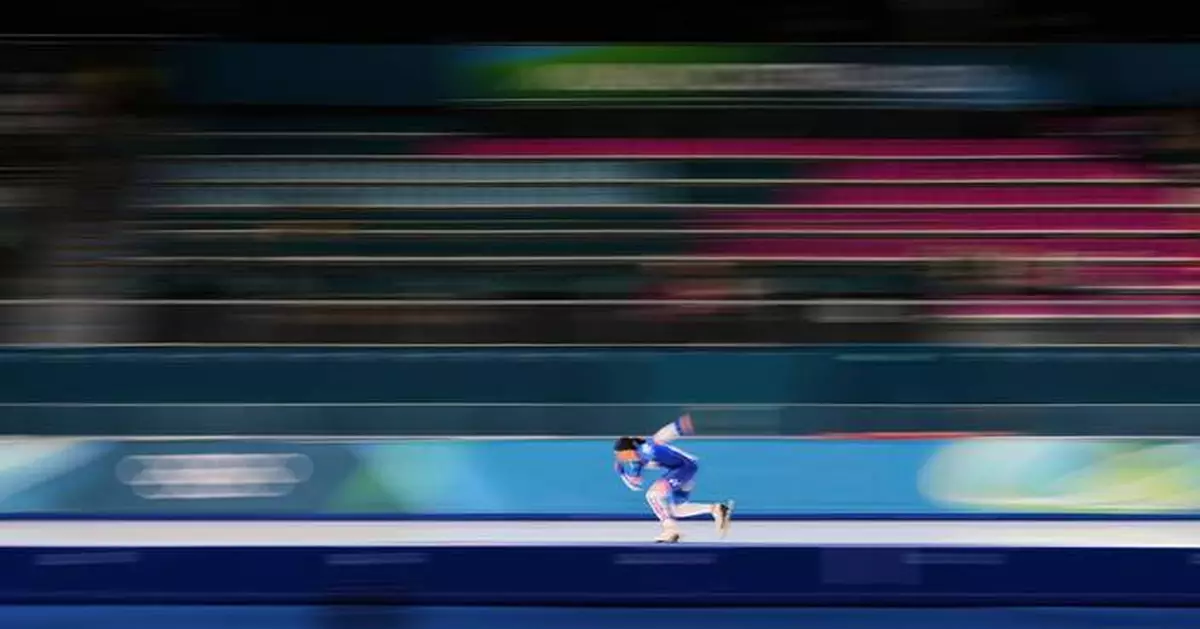 Photos show athletes as a blur of motion at the Milan Cortina Winter Olympics