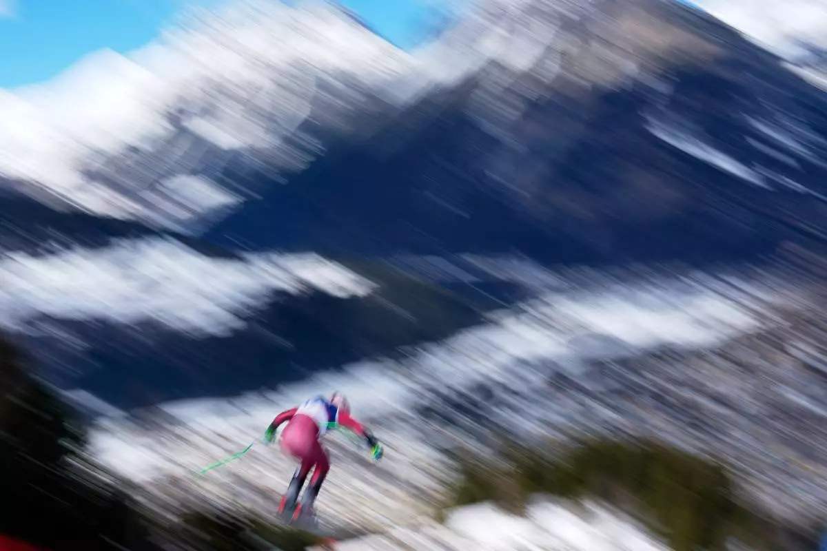 Canada's Cameron Alexander speeds down the course during an alpine ski, men's downhill race, at the 2026 Winter Olympics, in Bormio, Italy, Saturday, Feb. 7, 2026. (AP Photo/Julia Demaree Nikhinson)