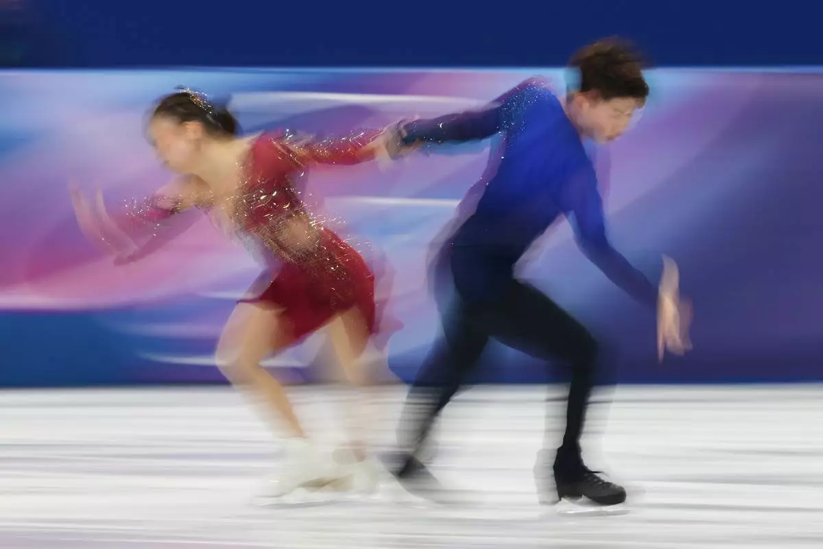 Utana Yoshida and Masaya Morita of Japan compete during the figure skating ice dance team event at the 2026 Winter Olympics, in Milan, Italy, Saturday, Feb. 7, 2026. (AP Photo/Francisco Seco)