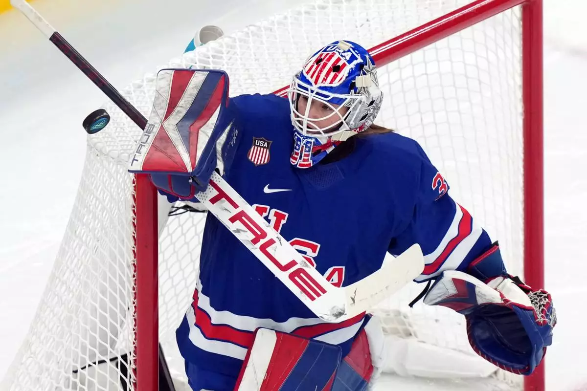 United States goalkeeper Aerin Frankel blocks a shot by Sweden during the second period of a women's ice hockey semifinal match at the 2026 Winter Olympics, in Milan, Italy, Monday, Feb. 16, 2026. (AP Photo/Carolyn Kaster)