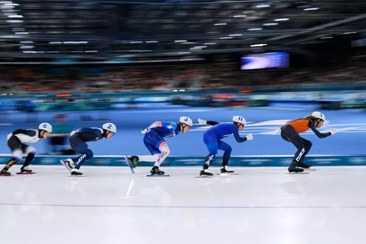 Jorrit Bergsma of the Netherlands is followed by Daniele di Stefano of Italy, Jordan Stolz of the U.S., Jae-won Chung of South Korea and Shomu Sasaki of Japan, as they compete in the men's mass start semifinal speedskating races at the 2026 Winter Olympics, in Milan, Italy, Saturday, Feb. 21, 2026. (AP Photo/Ben Curtis)