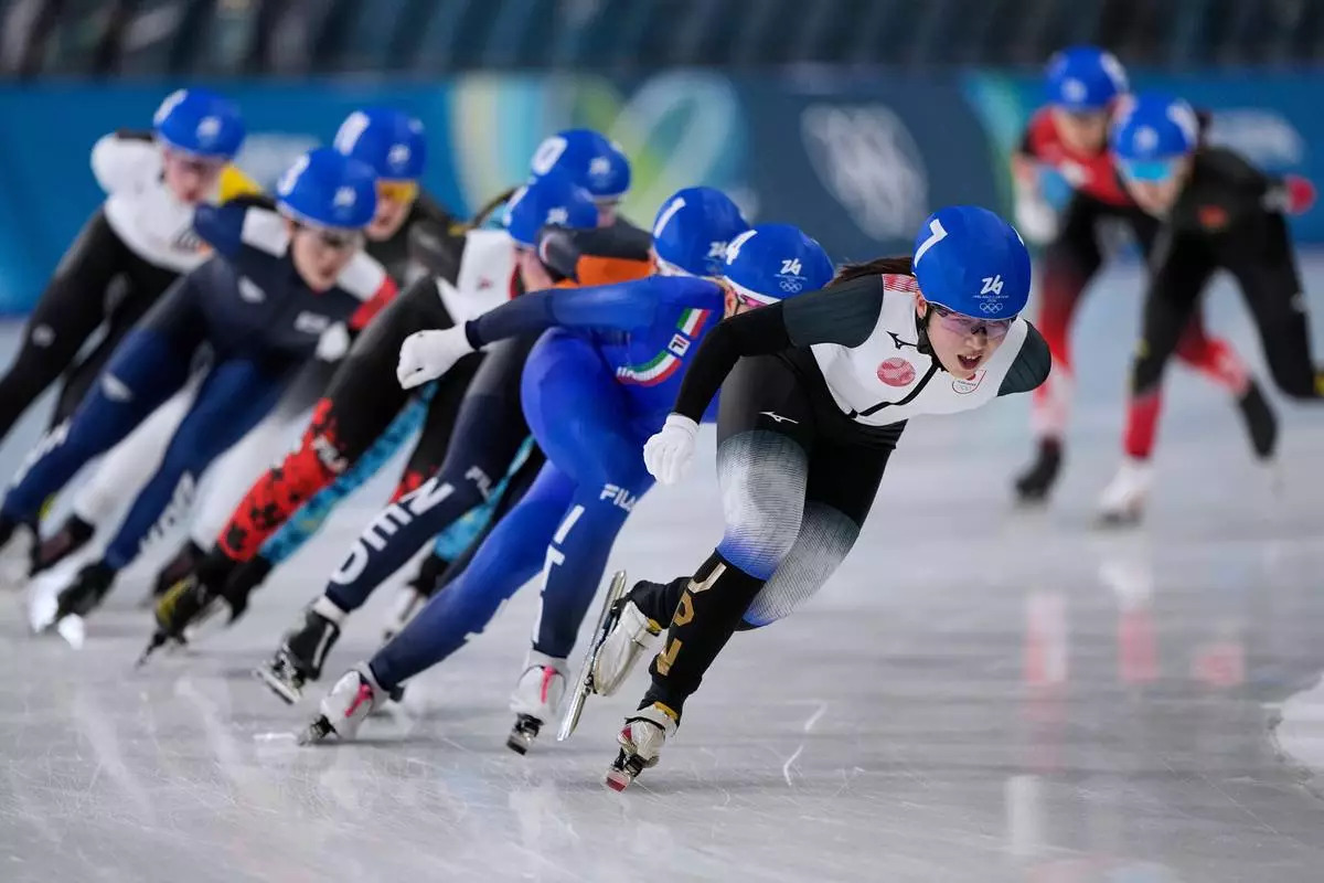 Momoka Horikawa of Japan leads before Francesca Lollobrigida of Italy as they compete in the women's mass start semifinal speedskating races at the 2026 Winter Olympics, in Milan, Italy, Saturday, Feb. 21, 2026. (AP Photo/Ben Curtis)