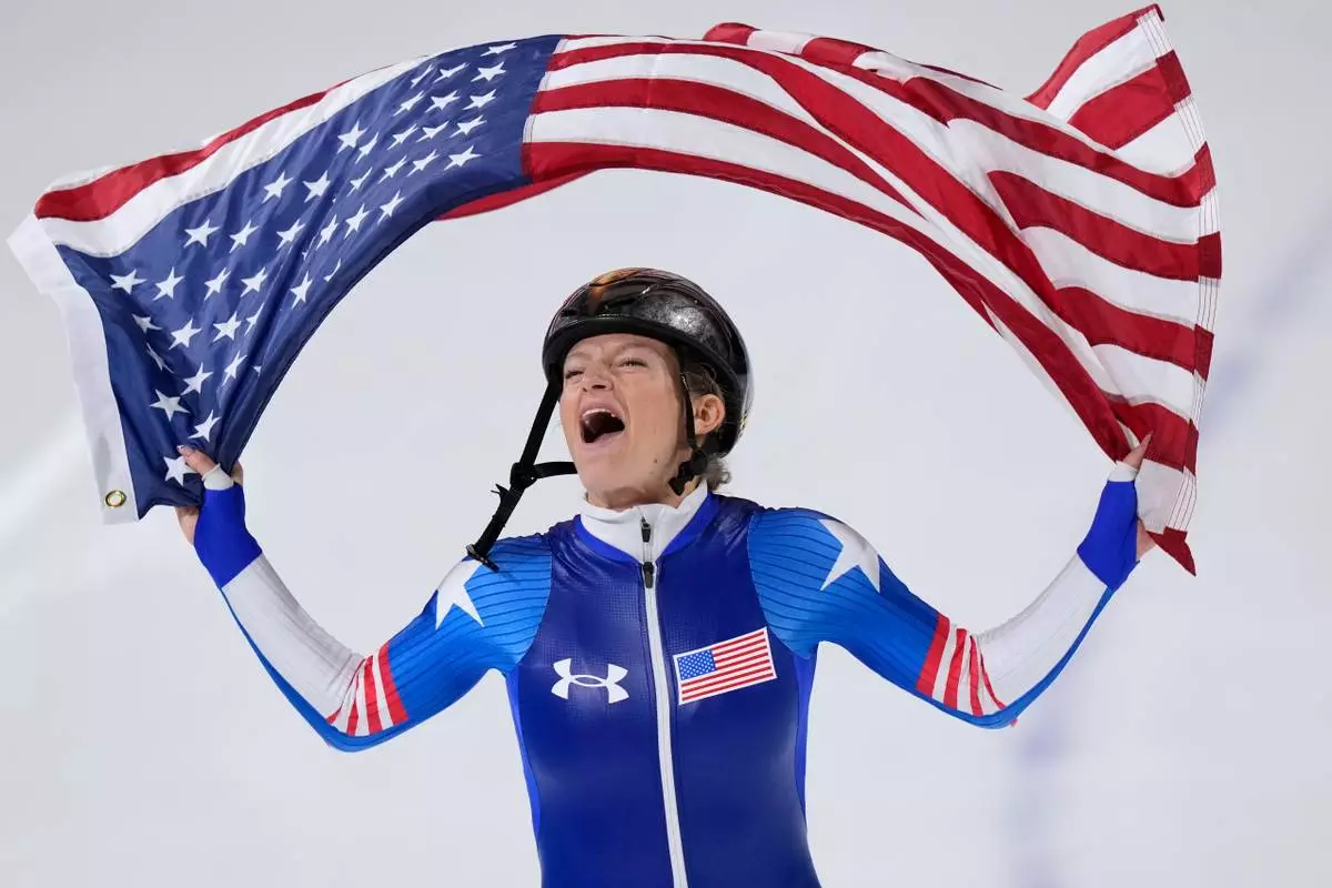 Mia Manganello of the U.S. celebrates winning the bronze medal in the women's mass start final speedskating race at the 2026 Winter Olympics, in Milan, Italy, Saturday, Feb. 21, 2026. (AP Photo/Luca Bruno)